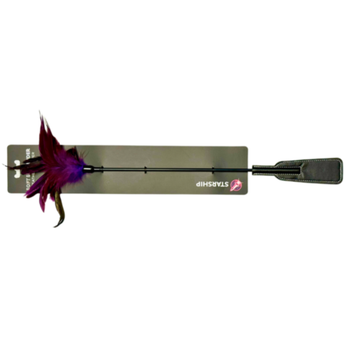 The Starship Feather Slapper features a riding crop with a black handle and flap end, enhanced by purple and red feathers at the top, crafting an enticing balance of pleasure and pain. It is presented in rectangular packaging marked with the STARSHIP labe