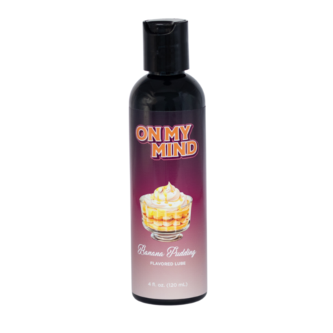 The On My Mind-Banana Pudding Flavored Lube in a black bottle features a dessert image and offers extra moisture for daily use, holding 4 fl. oz. (120 mL) of smoothness.