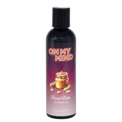 The ON MY MIND-Peanut Butter Flavored Lube 4oz bottle features peanut butter, peanuts, and a swirl design. This 120 mL lube provides extra moisture for enhanced comfort, making it perfect for daily use.