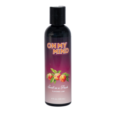 The On My Mind-Sweet as a Peach Flavored Lube 4oz offers a peachy experience with its extra moisture formula, distinguished by a purple label featuring peaches and Peach Flavored Lube text, finished with a black cap for added flavor and fun.