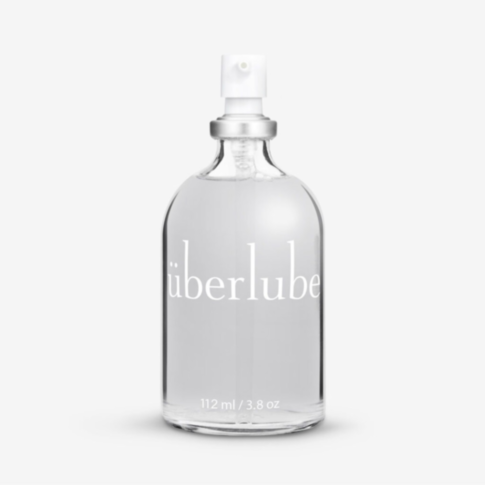 A rocket and planet design on a green background with a white circle, featuring the text "No Image" above it, evokes the smooth performance of the premium Uberlube 112ml Bottle, known for being latex-compatible.